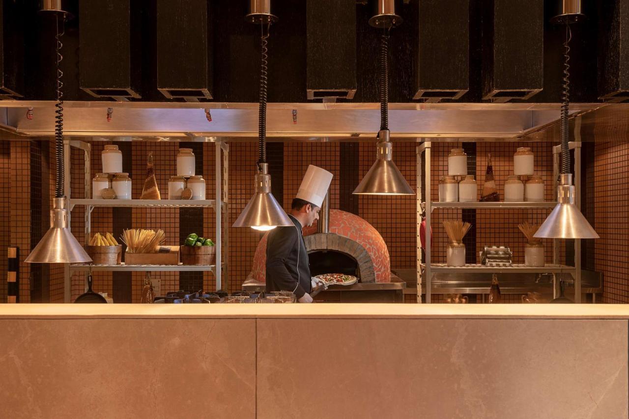 Radisson Blu Hotel Amritsar Exterior photo A chef working in a restaurant kitchen
