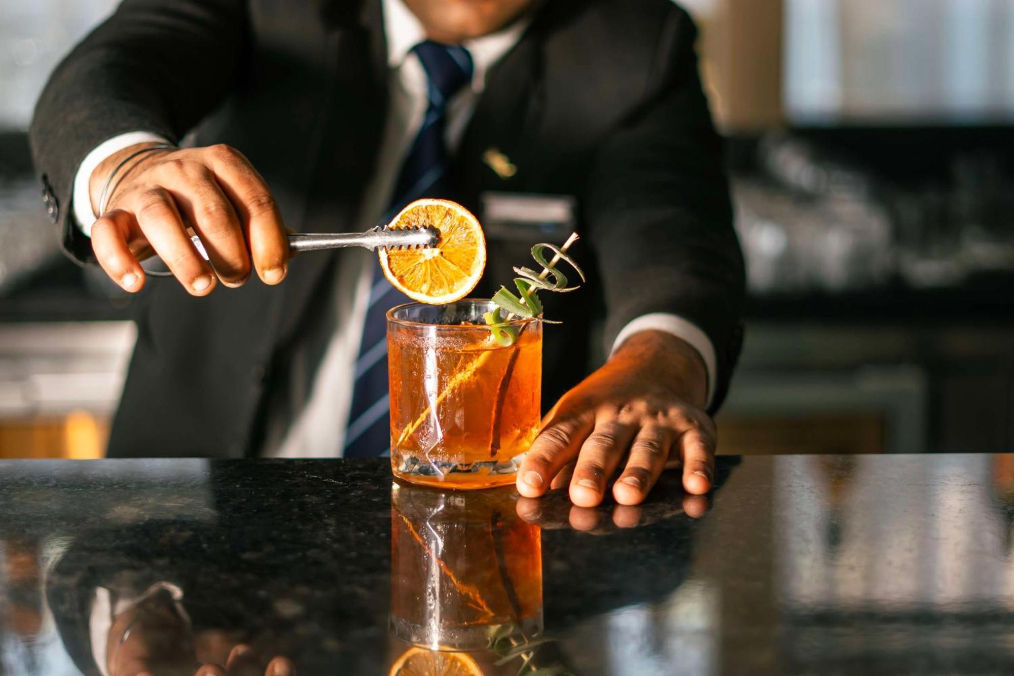 Radisson Blu Hotel Amritsar Exterior photo A bartender preparing a cocktail